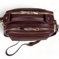 Elegant dark red genuine leather women’s satchel handbag with structured medium design and gold-tone accents — perfect for everyday and office wear.