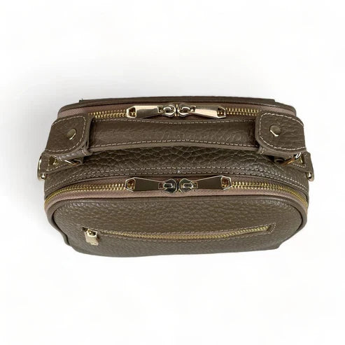 Beige leather women's handbag with shoulder strap — elegant satchel for everyday and formal occasions.