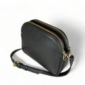 Premium black leather crossbody shoulder bag with adjustable strap, sleek minimalist design, and high-quality stitching for everyday use.