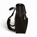LeatherLuxe black leather women’s backpack with sleek minimalist design, adjustable shoulder straps, and gold hardware — perfect for work, travel, or everyday style.