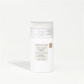 Kristin Ess balm on a white background