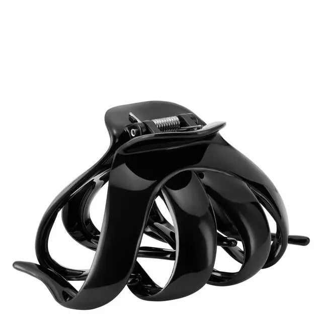 Black hair claw clip on a white background