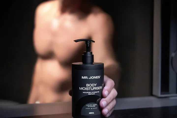 The Body Pack – Men’s Body Care Set including body wash, body lotion, and grooming essentials, arranged neatly on a bathroom counter for men’s skincare