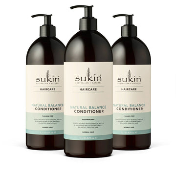 Three bottles of Sukin Natural Balance Conditioner on a white background
