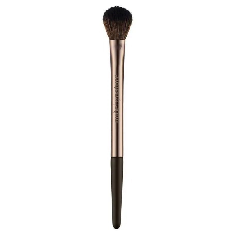 Makeup brush with rose gold handle and black bristles on a white background