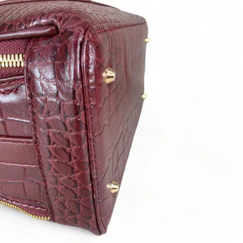 Red leather women's handbag – premium satchel and shoulder bag with elegant stitching, gold-tone hardware, and adjustable strap – luxury fashion accessory for women.