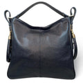 Black genuine leather tote bag with premium craftsmanship, minimalist design, and spacious interior from LeatherLuxe.