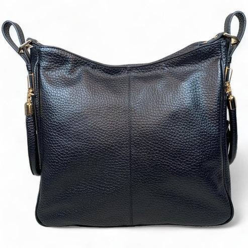 Black genuine leather tote bag with premium craftsmanship, minimalist design, and spacious interior from LeatherLuxe.