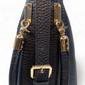 Black genuine leather tote bag with premium craftsmanship, minimalist design, and spacious interior from LeatherLuxe.