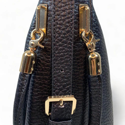 Black genuine leather tote bag with premium craftsmanship, minimalist design, and spacious interior from LeatherLuxe.