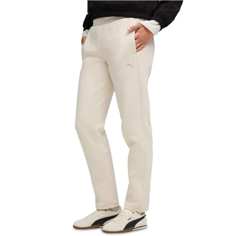 Person wearing beige pants with a white background