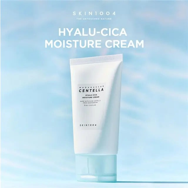 Skint004 Hyalu-Cica Moisture Cream tube on a light blue gradient background