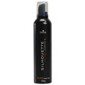 Black bottle of Schwarzkopf Silhouette hair mousse on a white background
