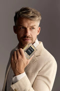 Virtue Eau De Parfum for men in sleek glass bottle with black label and cap, displayed with lifestyle shots and luxury background
