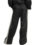 Adidas Stadium Stripes Tracksuit Bottoms in black with signature 3-Stripes, soft recycled polyester-cotton blend, satin piping, and matte rubber-print logo.
