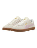White sneakers with pink accents and brown soles on a white background