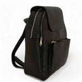 LeatherLuxe black leather women’s backpack with sleek minimalist design, adjustable shoulder straps, and gold hardware — perfect for work, travel, or everyday style.